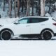 A white vehicle in the snow